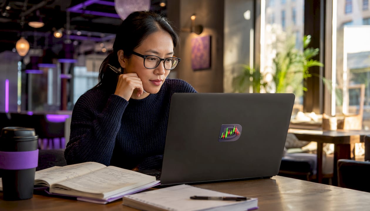 Trader analyzing price charts at home office