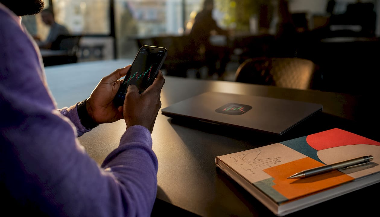 Hands scrolling limit order on smartphone