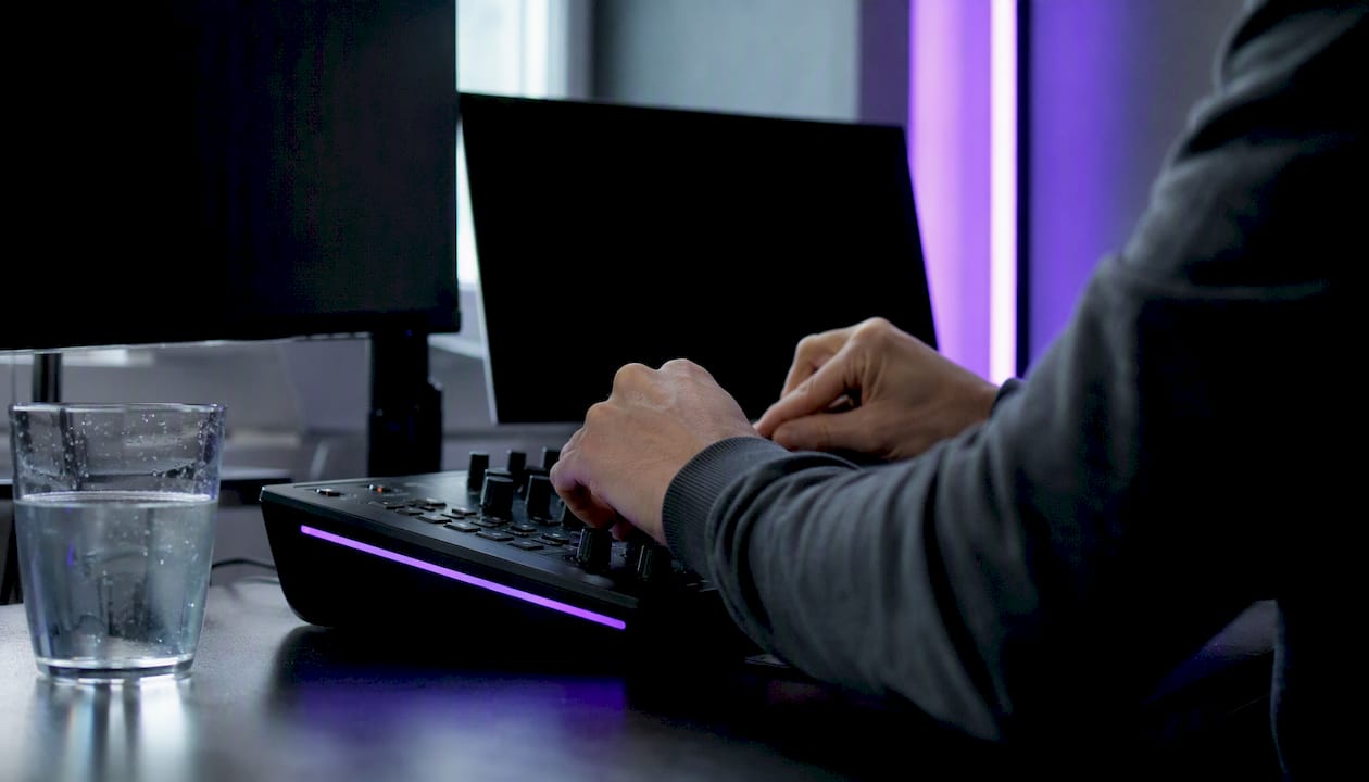 Trader hands adjusting trading controls