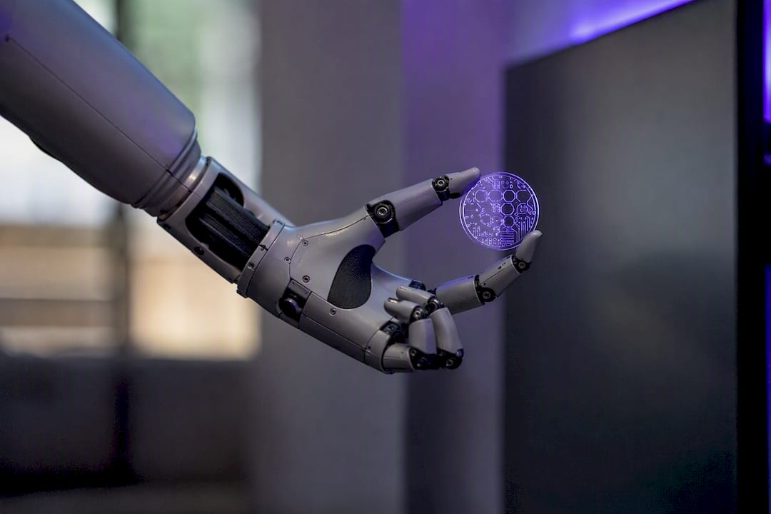 Robotic arm placing trade tag token next to screen