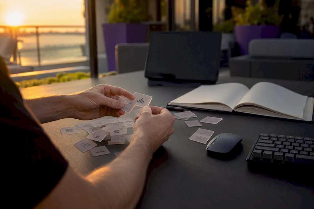 Trader’s hands manually sorting crypto trade tags