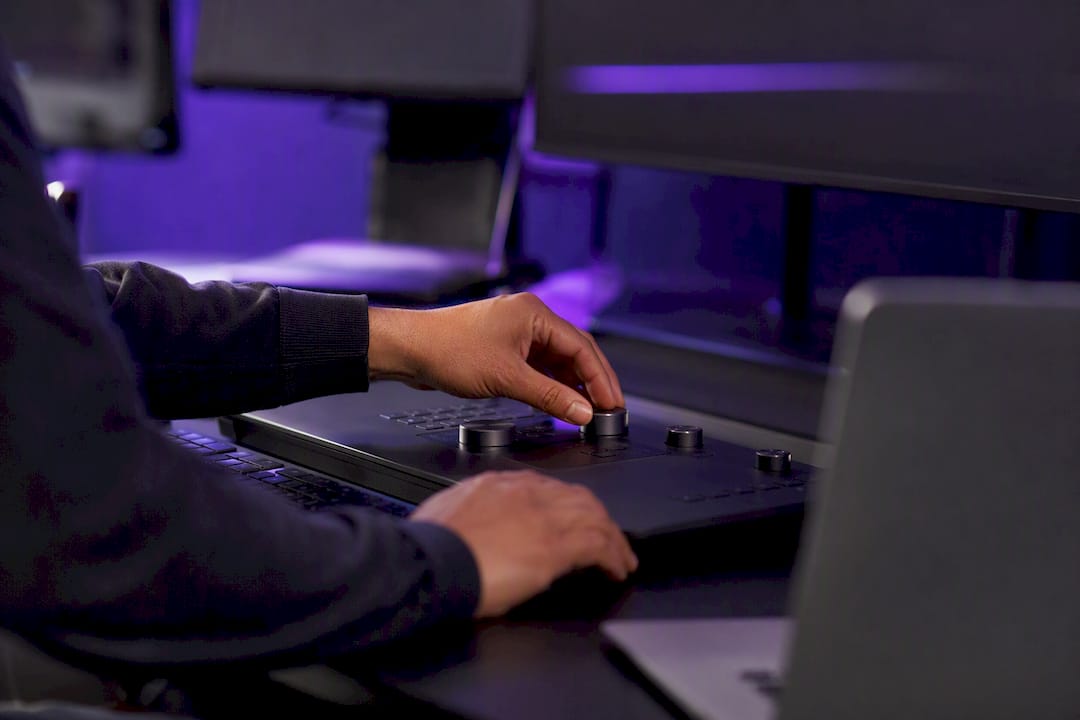 Trader hands adjusting liquidity dial