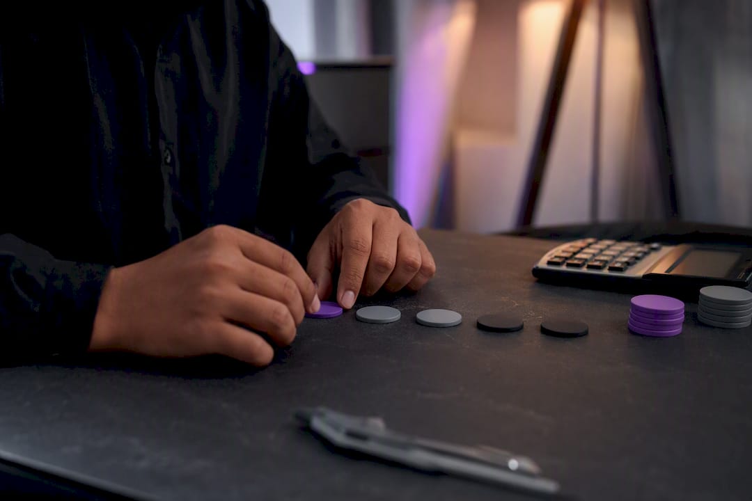 Trader adjusting risk tokens at desk