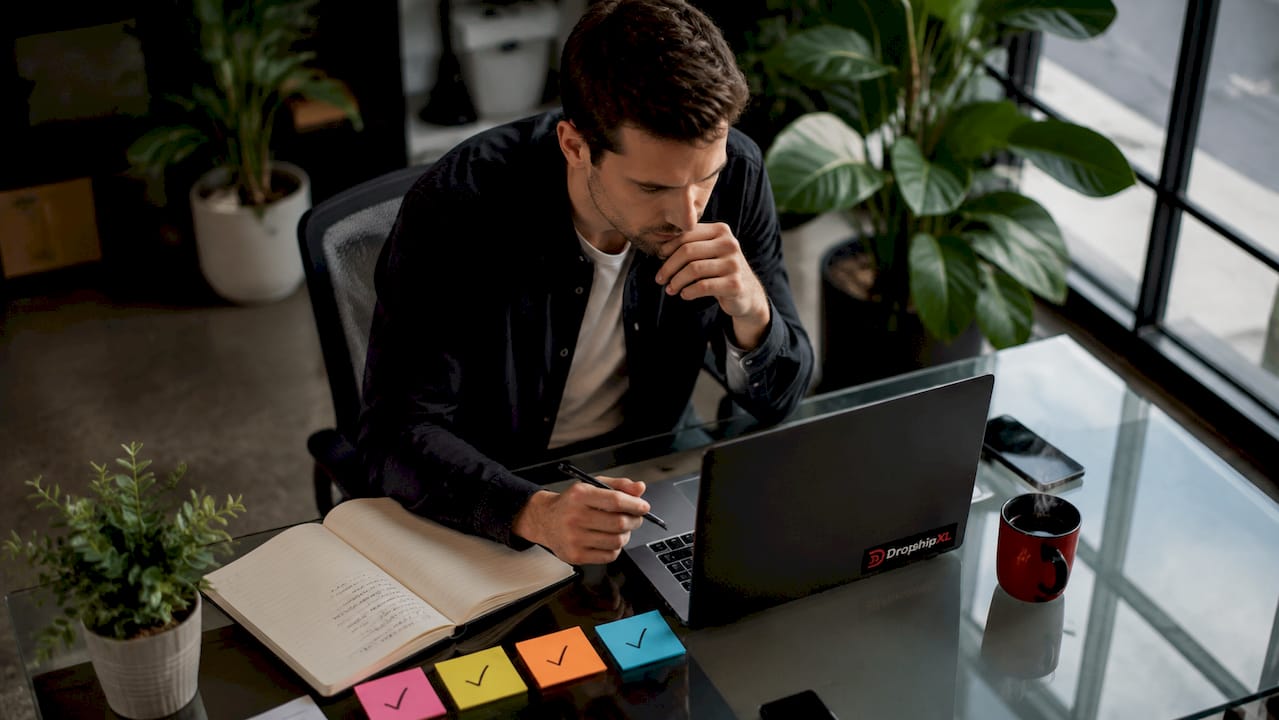 dropshipper reviewing suppliers at desk