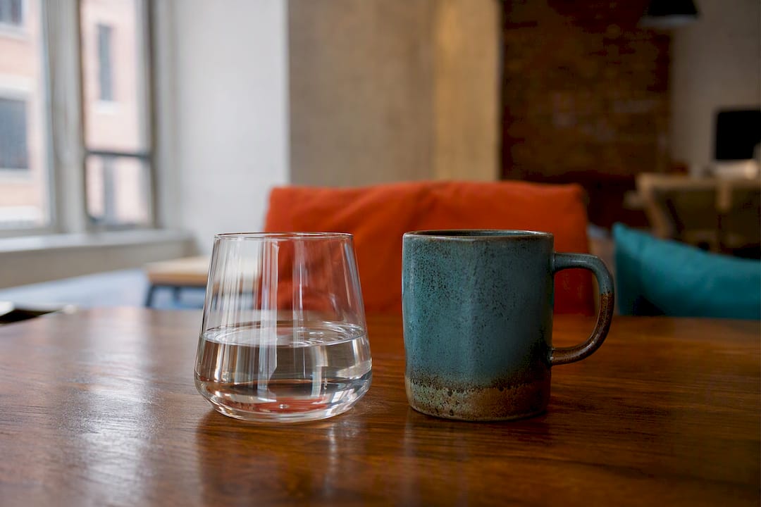 Branded drinkware cups on table