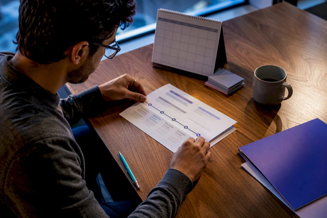 Job seeker reviewing resume employment timeline