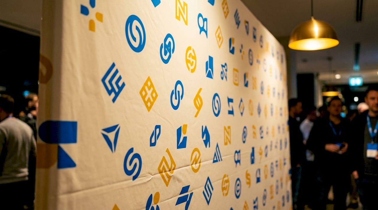 Close-up of repeated logos on step repeat banner fabric