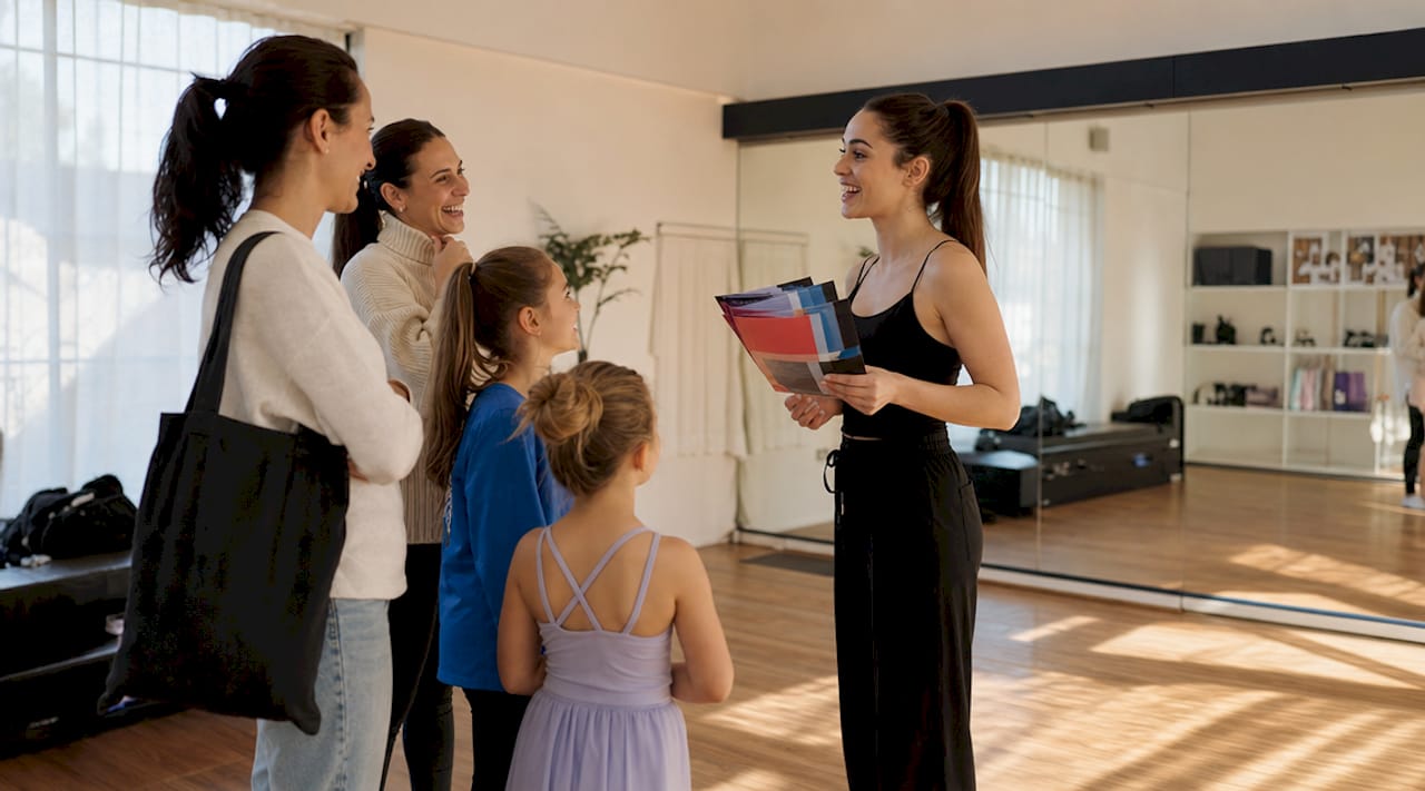 Dancer distributing dance flyers in community center