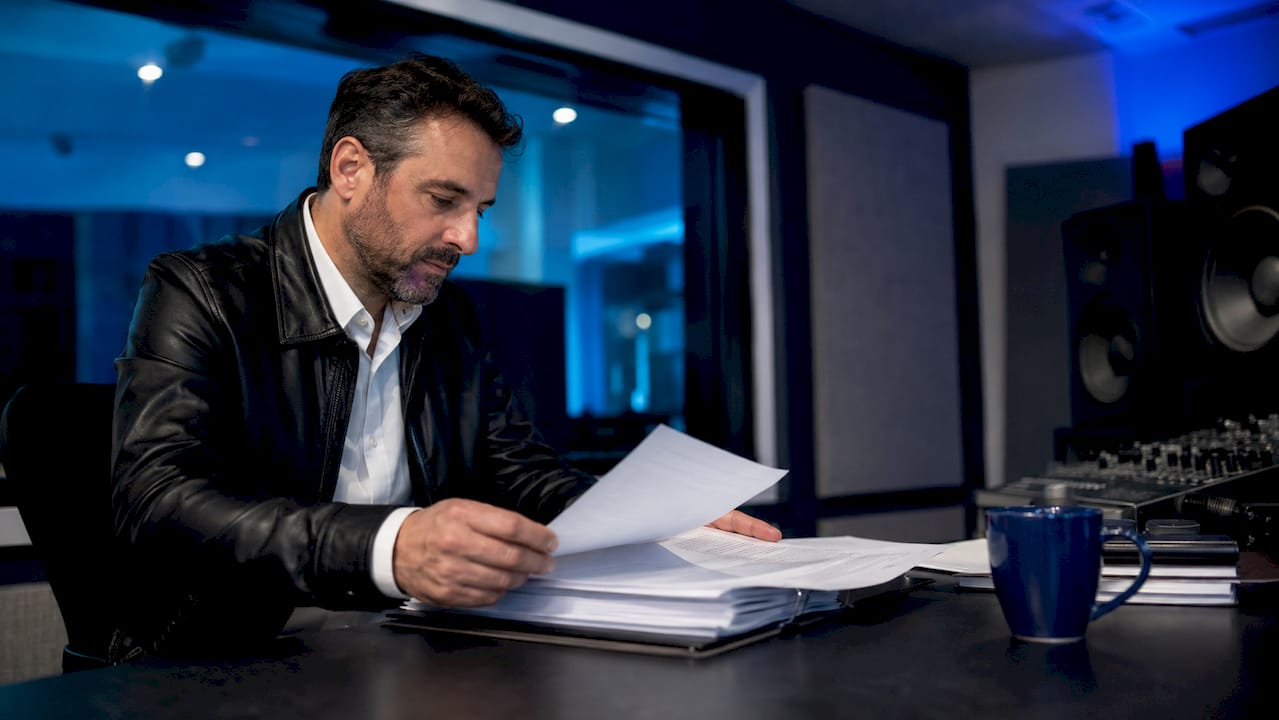 Producer reviewing production package contract