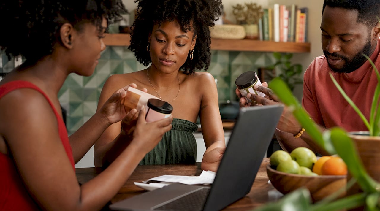 Overhead view of diverse consumers with beauty products