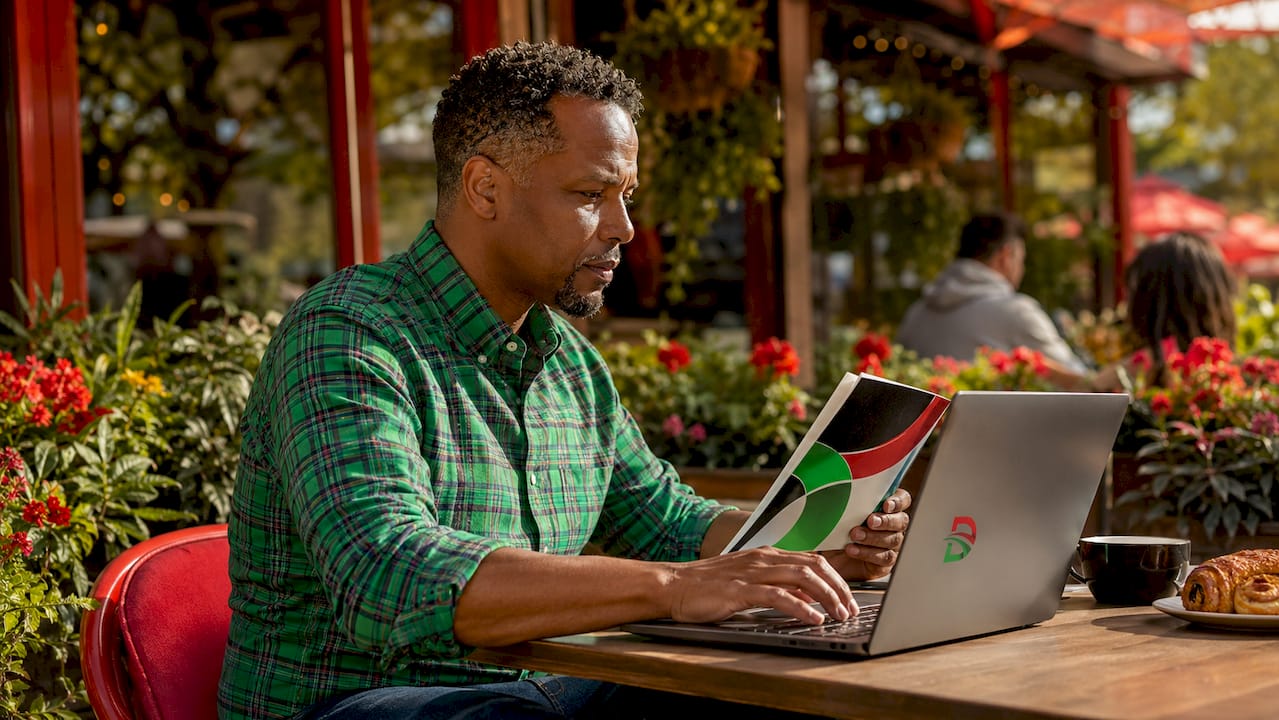 Man researching affordable Black-owned brands in café