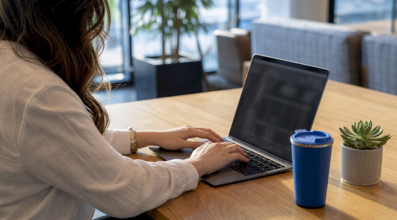 Woman exporting images from PDF using Adobe Acrobat Pro
