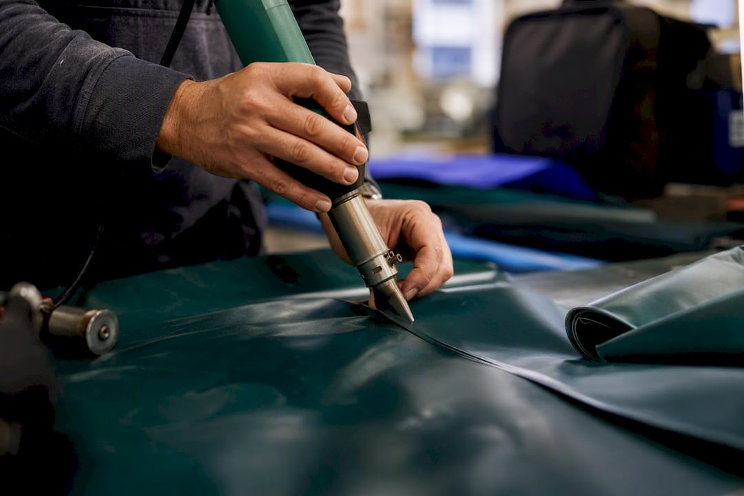 Technician welding waterproof fabric seams
