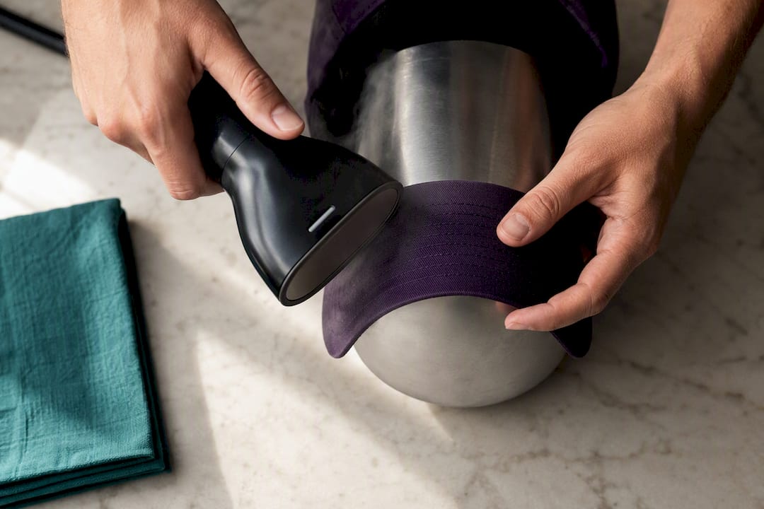 Shaping a fabric cap brim with steam