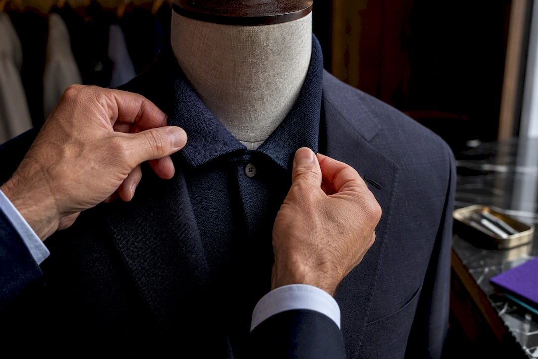Structured polo collar standing beneath lapel