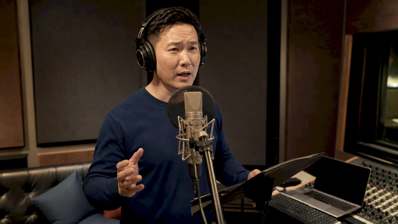 Voice actor recording in professional booth