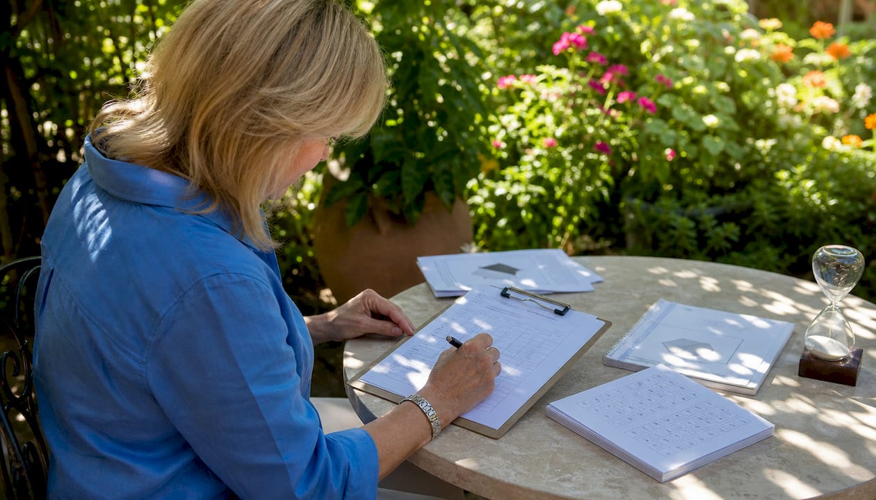 Hands filling neuropsychological test form