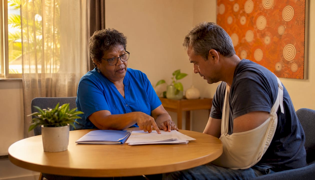 Workers comp weekly payments process: NSW guide for injured workers 2 Occupational therapist consulting injured worker in office
