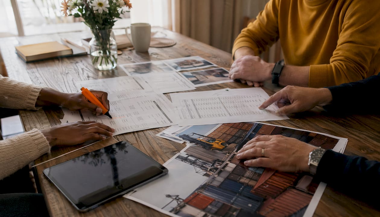 Close-up of hands reviewing carrier liability paperwork