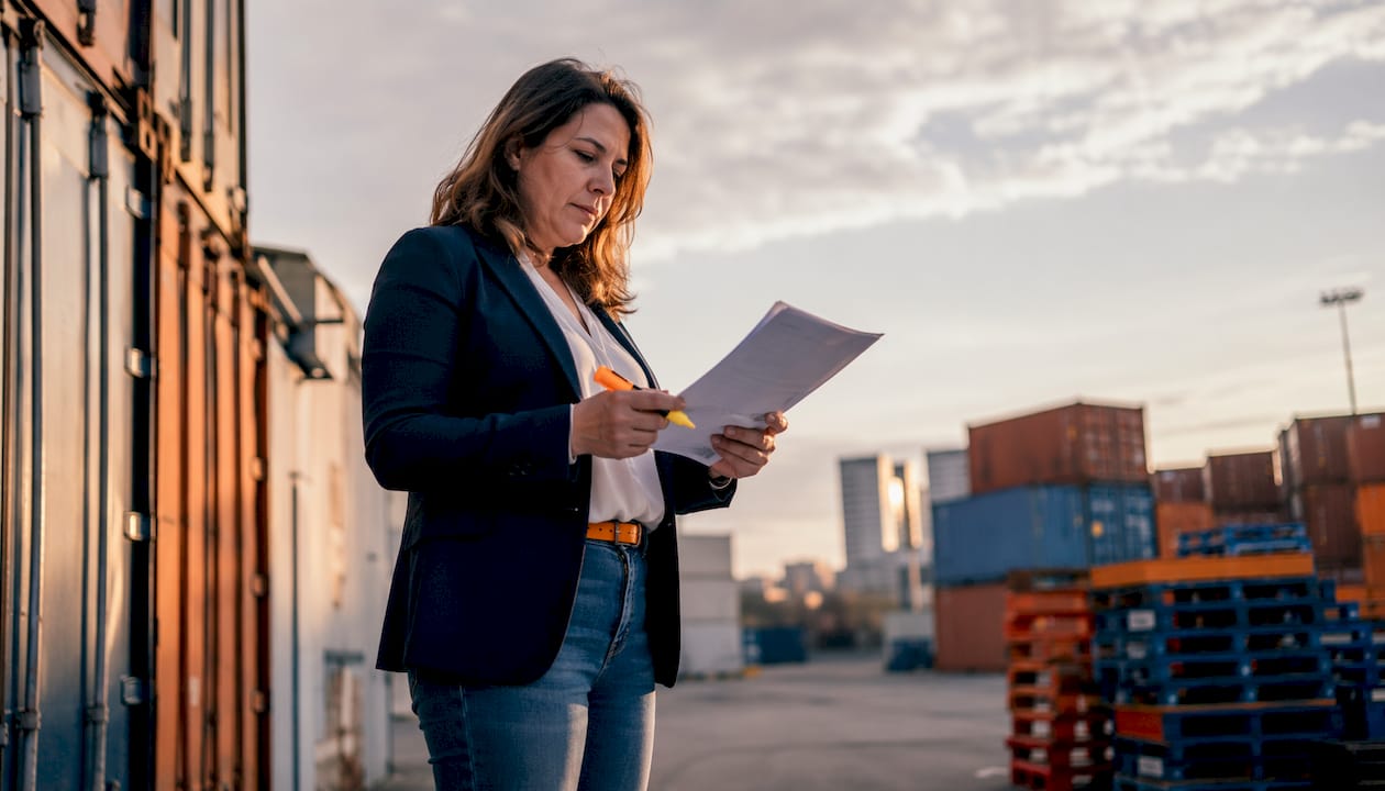 Logistics manager monitoring cargo tracking systems