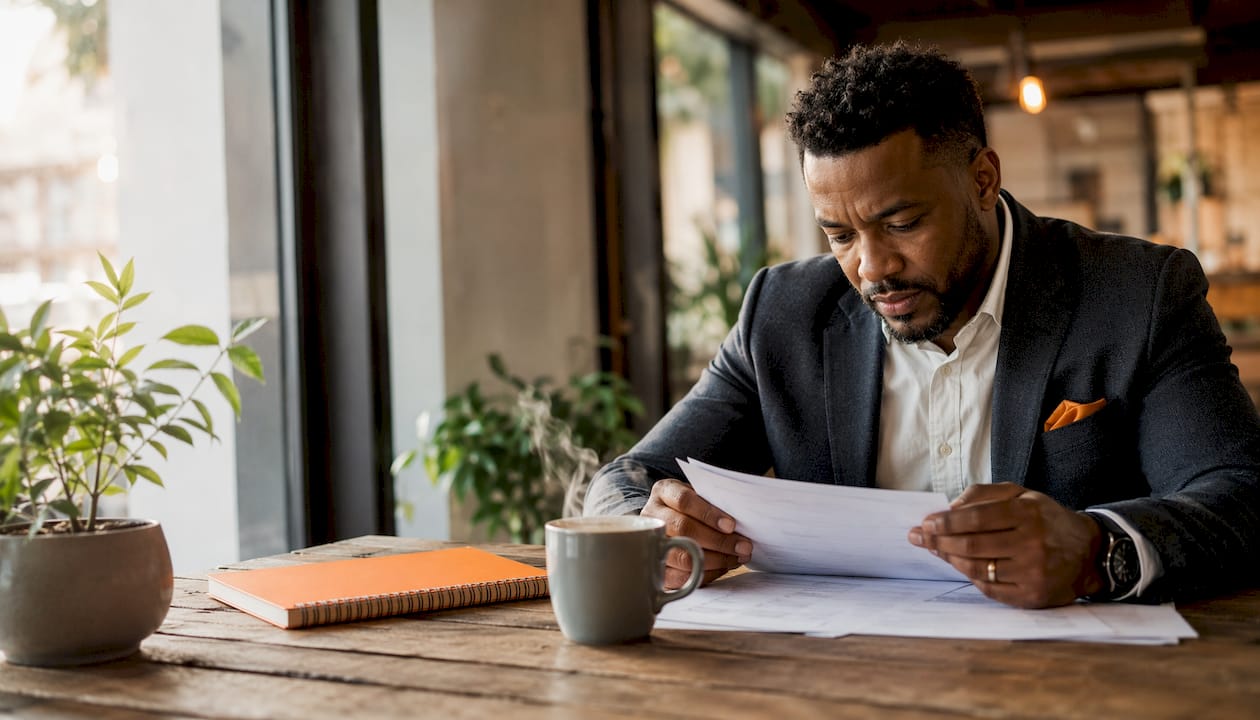 Customs broker reviewing shipment paperwork