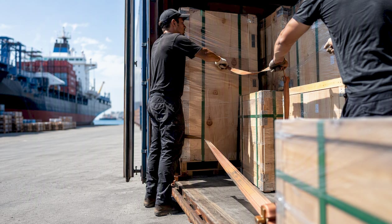 Furniture crates loaded into container at port