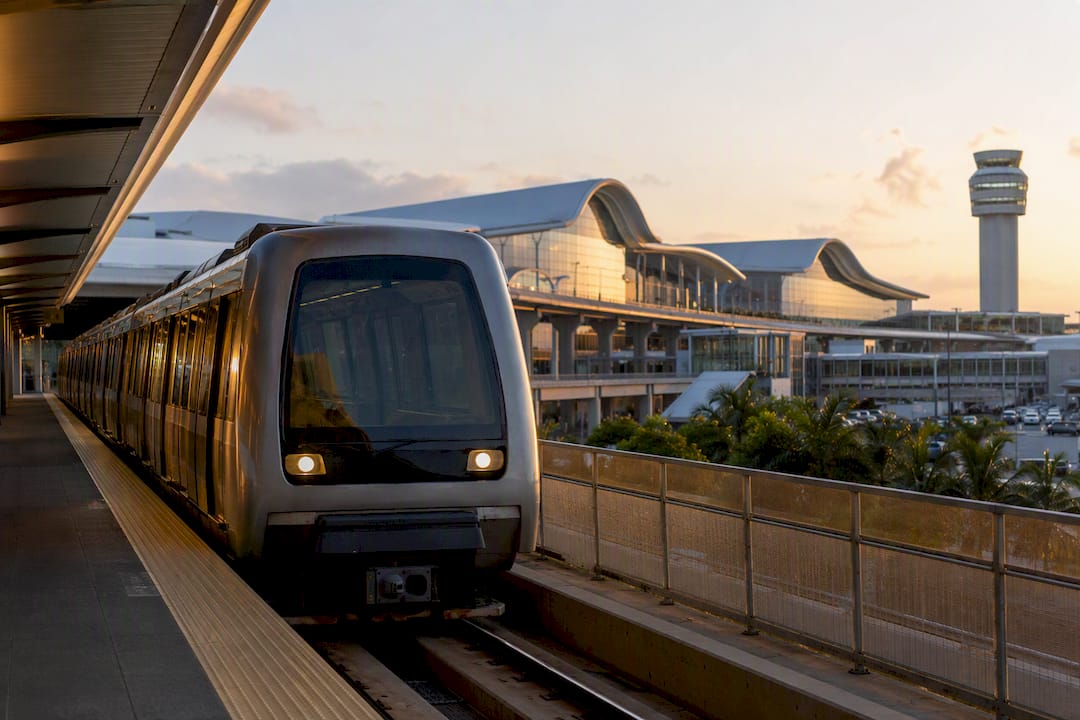 Intercity train arriving at airport station