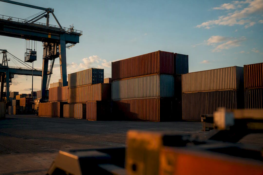 Full shipping containers stacked in a container yard