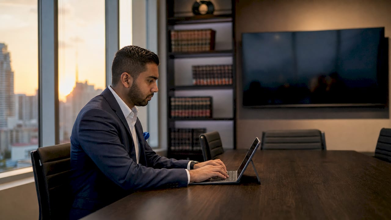 Hands using automated legal compliance software