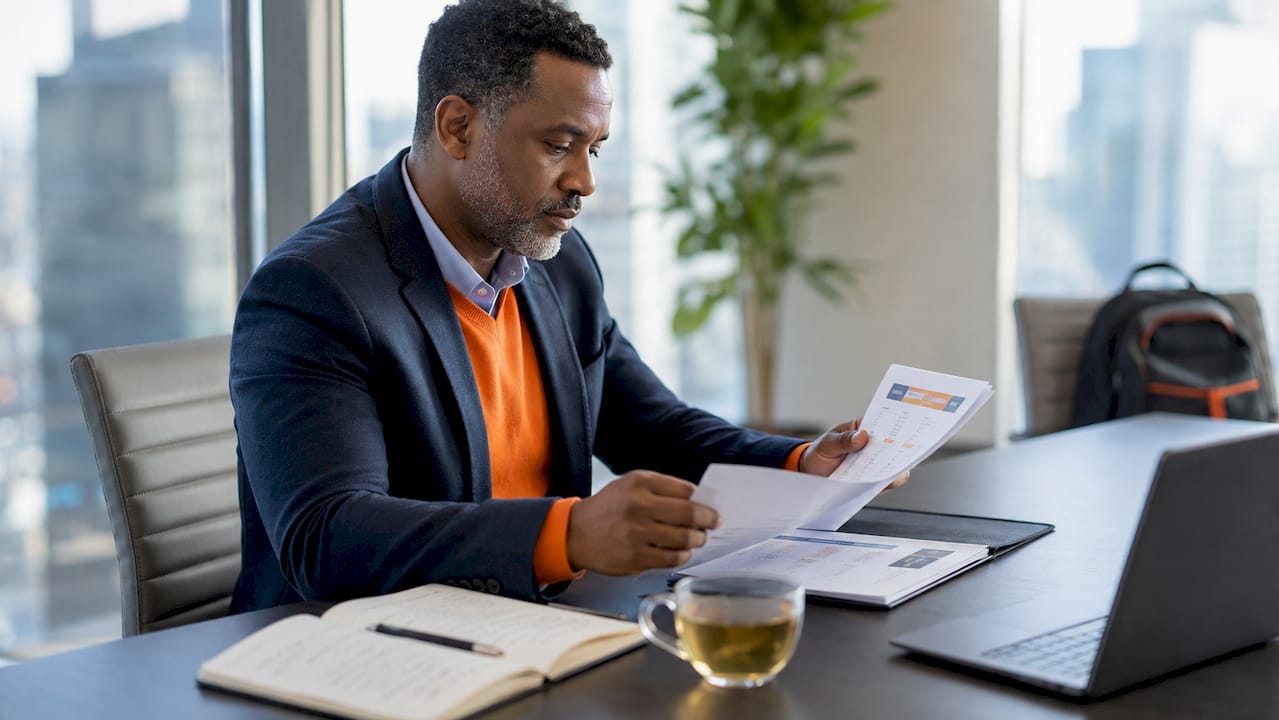 Leader reviewing leadership development materials