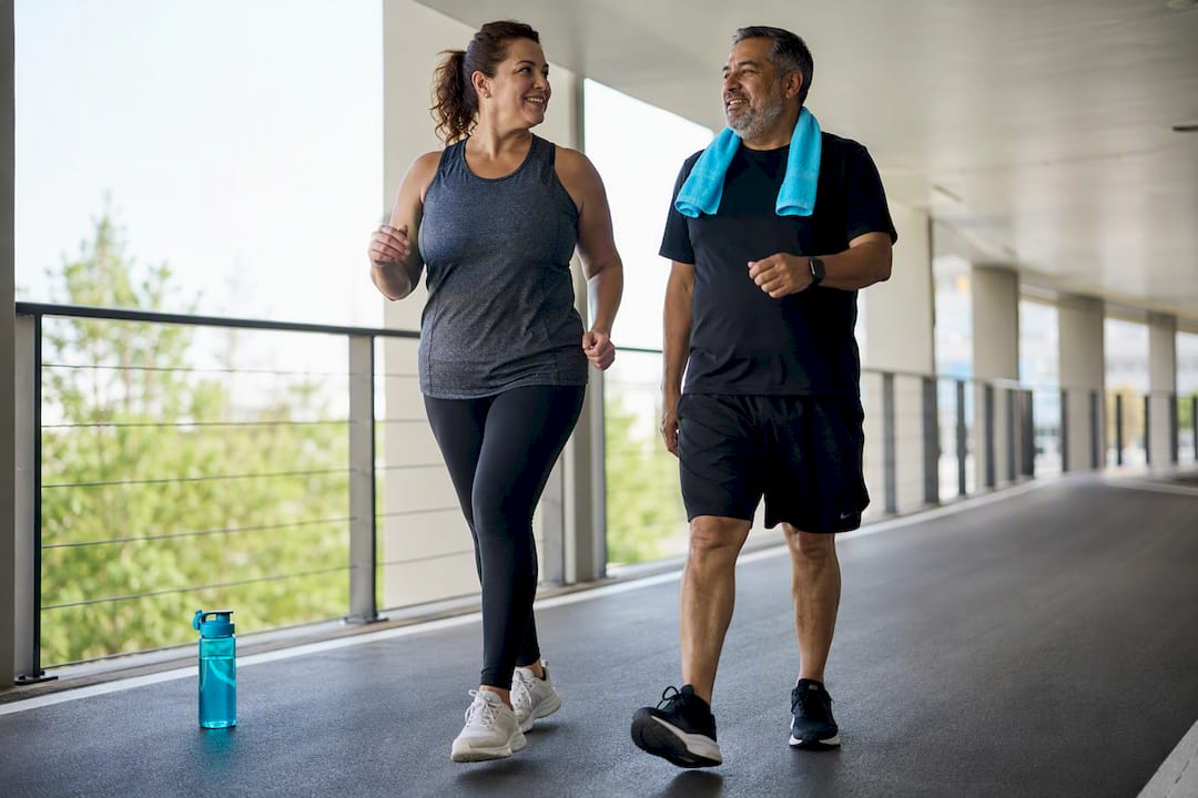 Adults walking together on a community track