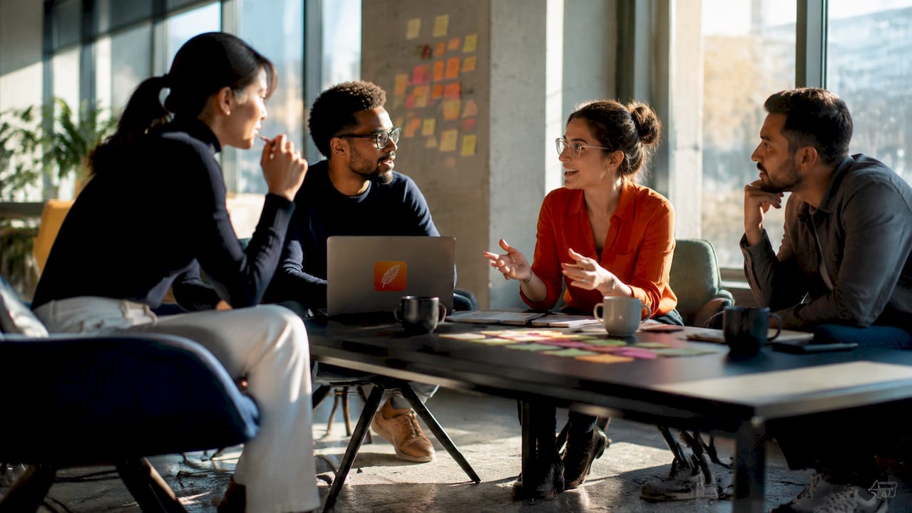 Cybersecurity team collaborating in meeting room