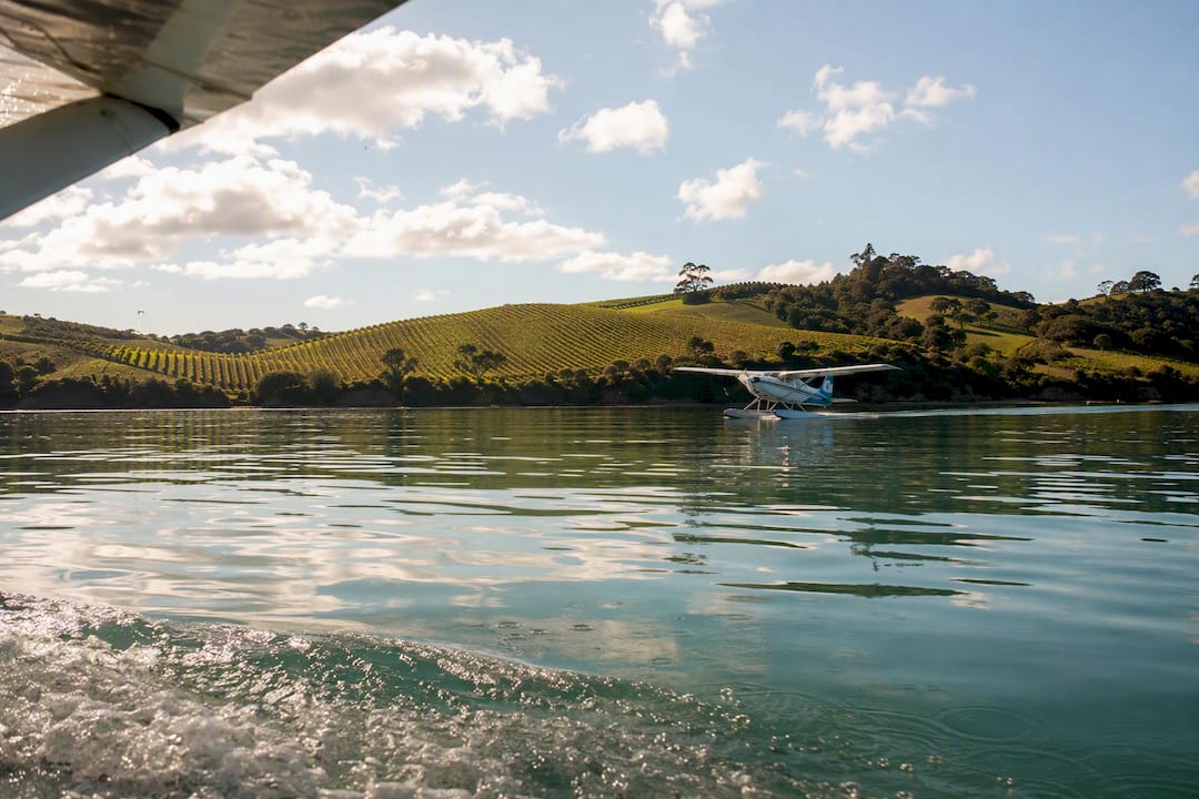 Seaplane landing on coastal waters near Waiheke