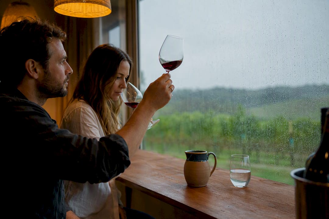 Guests tasting wine in sheltered room