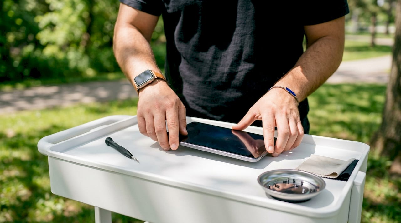 Technician resetting student device for repair