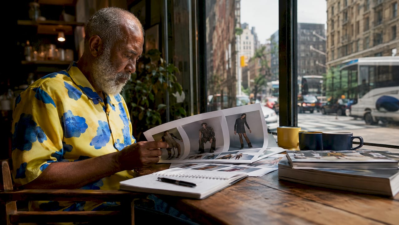 Media gatekeeper reviewing layouts in NYC office