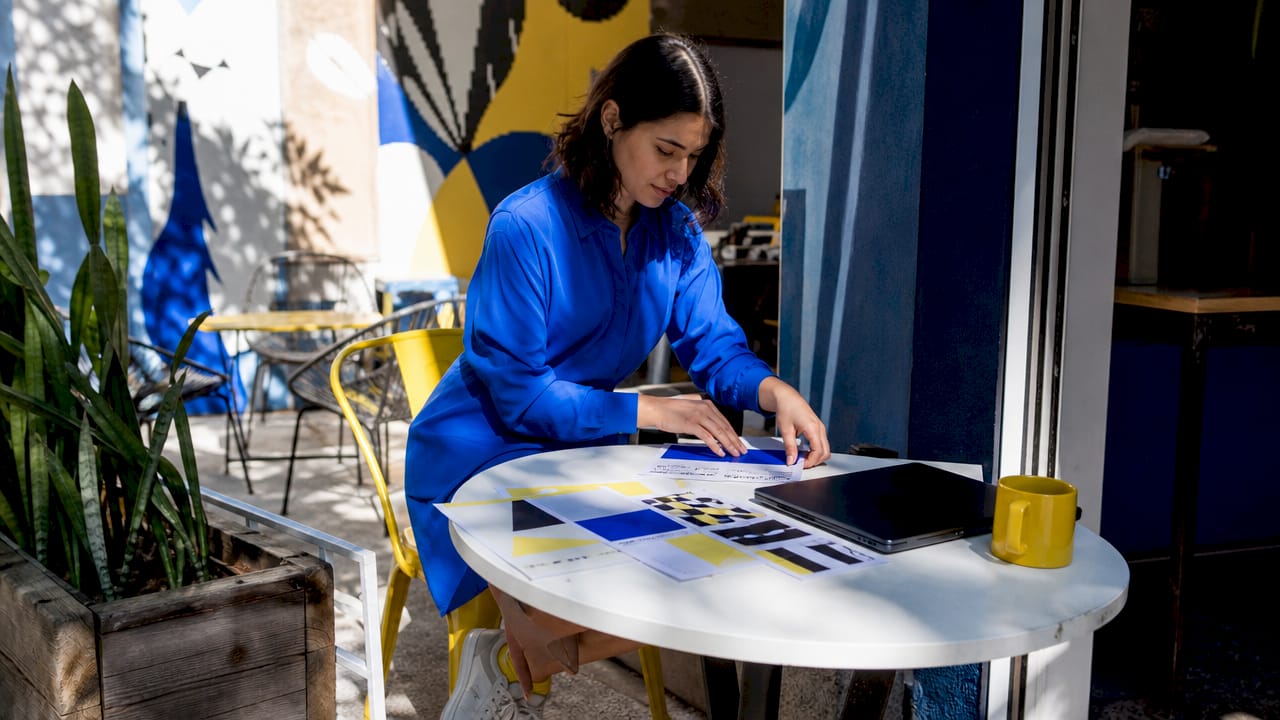 Marketing professional organizing visual branding materials