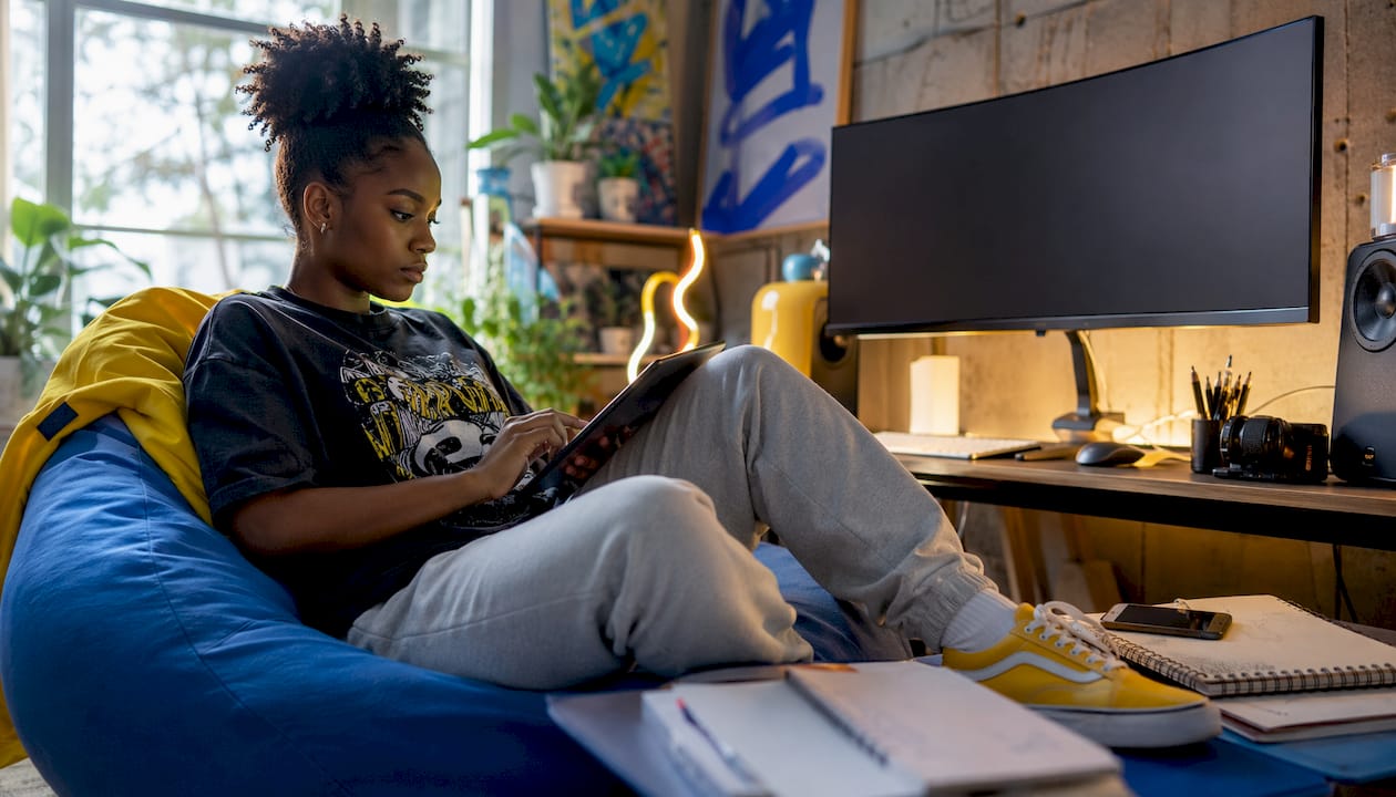 Woman assembling digital creator tools at desk