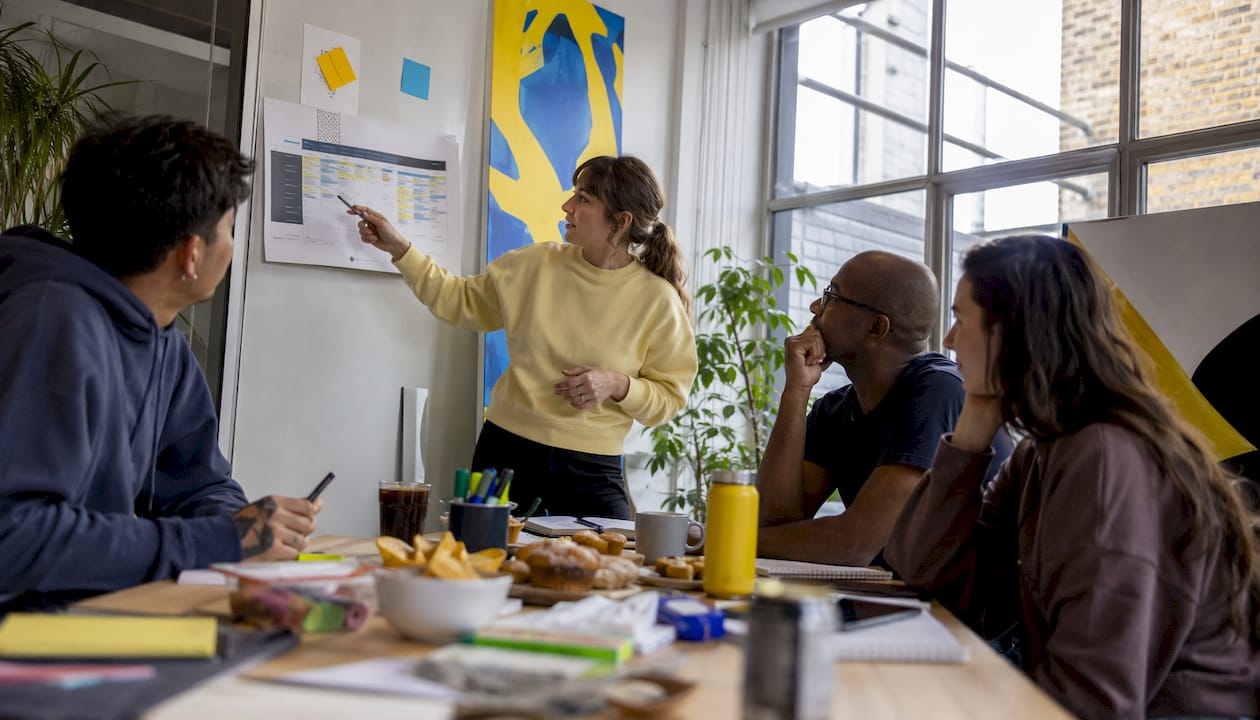 Production manager leading team meeting