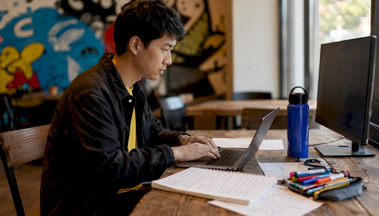 Hands using marketing analytics tools at desk