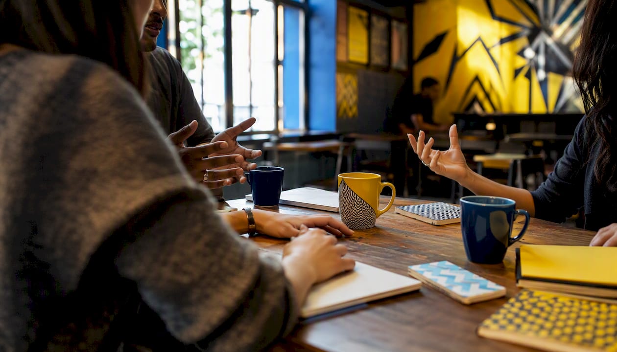 Hands gesturing during outdoor creative micro-event