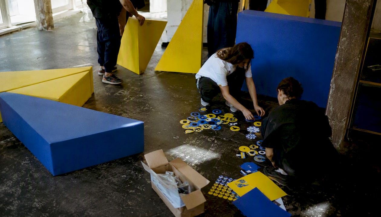 Hands arranging community event setup