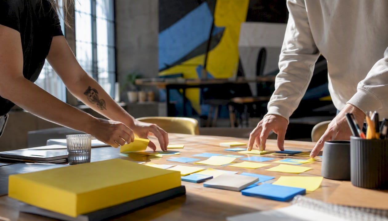 Hands arranging lead generation materials
