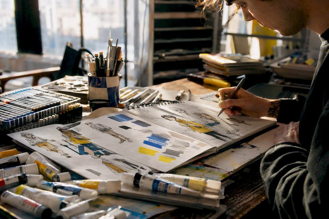 Art supplies and color palettes on animator desk