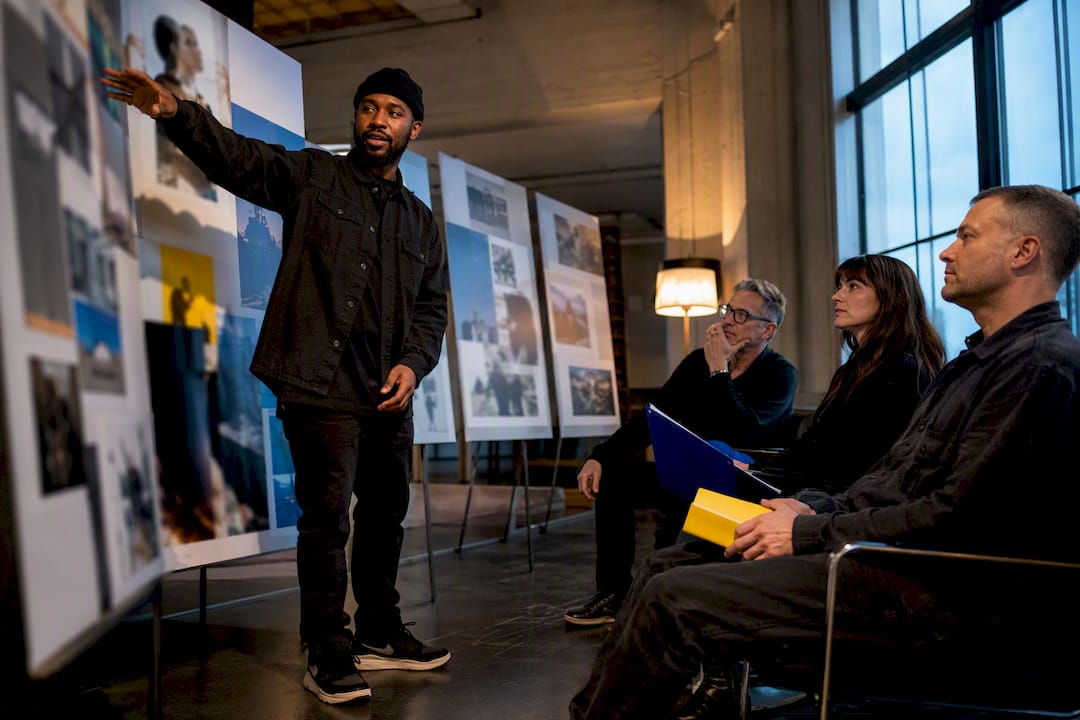 Creative director presenting work to hiring panel