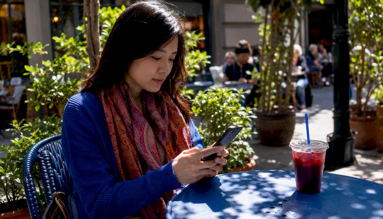 Hands using library ebook borrowing app on phone