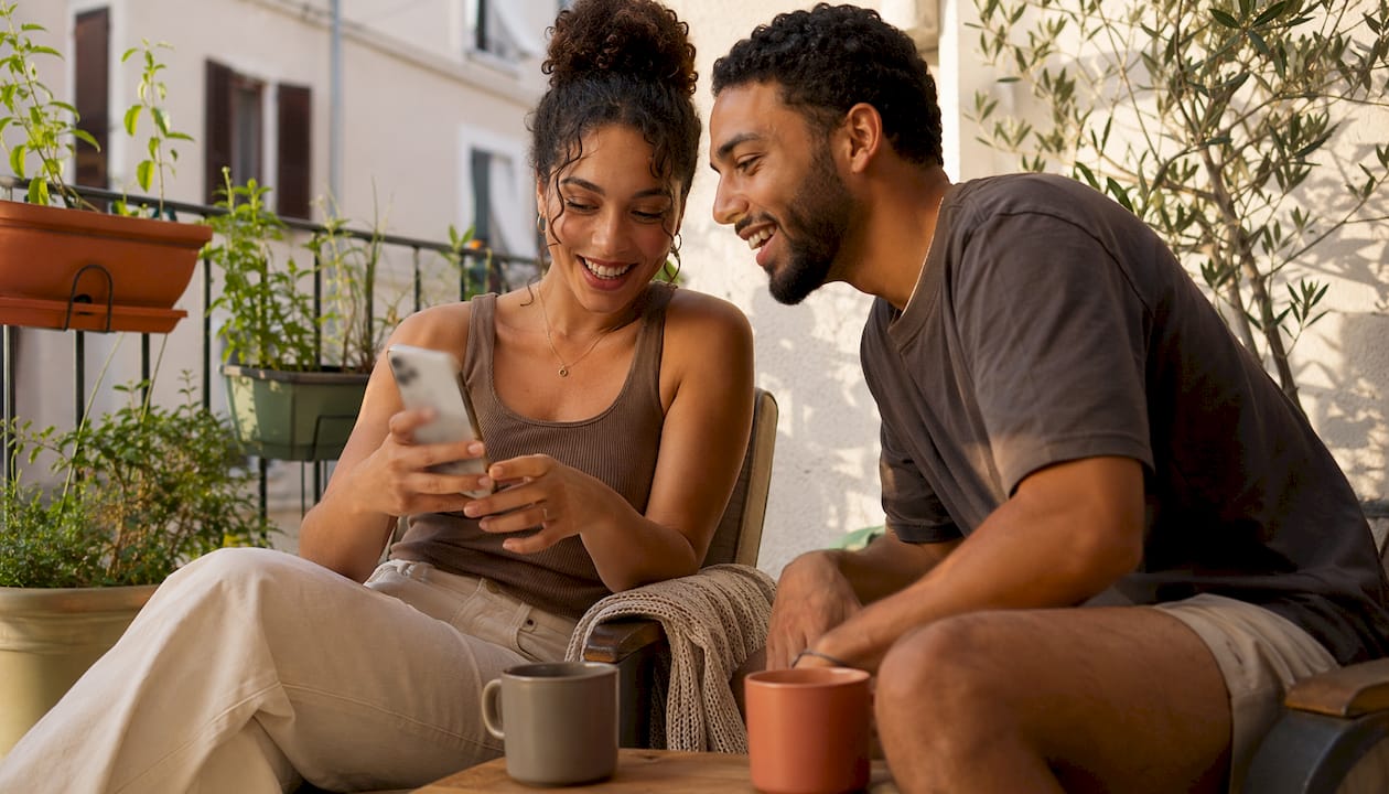 Couple discussing personalized messages on phone