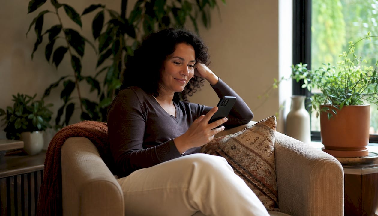Person setting message timing on smartphone