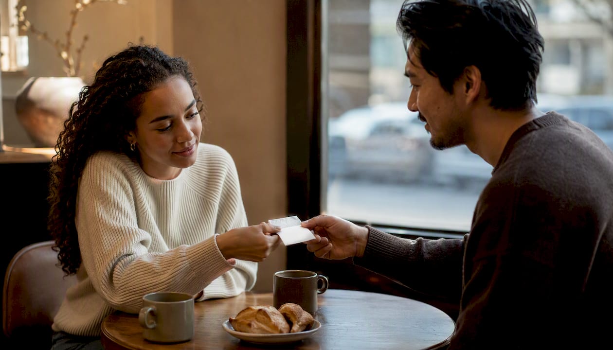 Hands exchanging note practicing communication