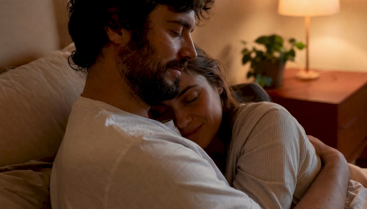 Couple sharing a gentle bedtime hug